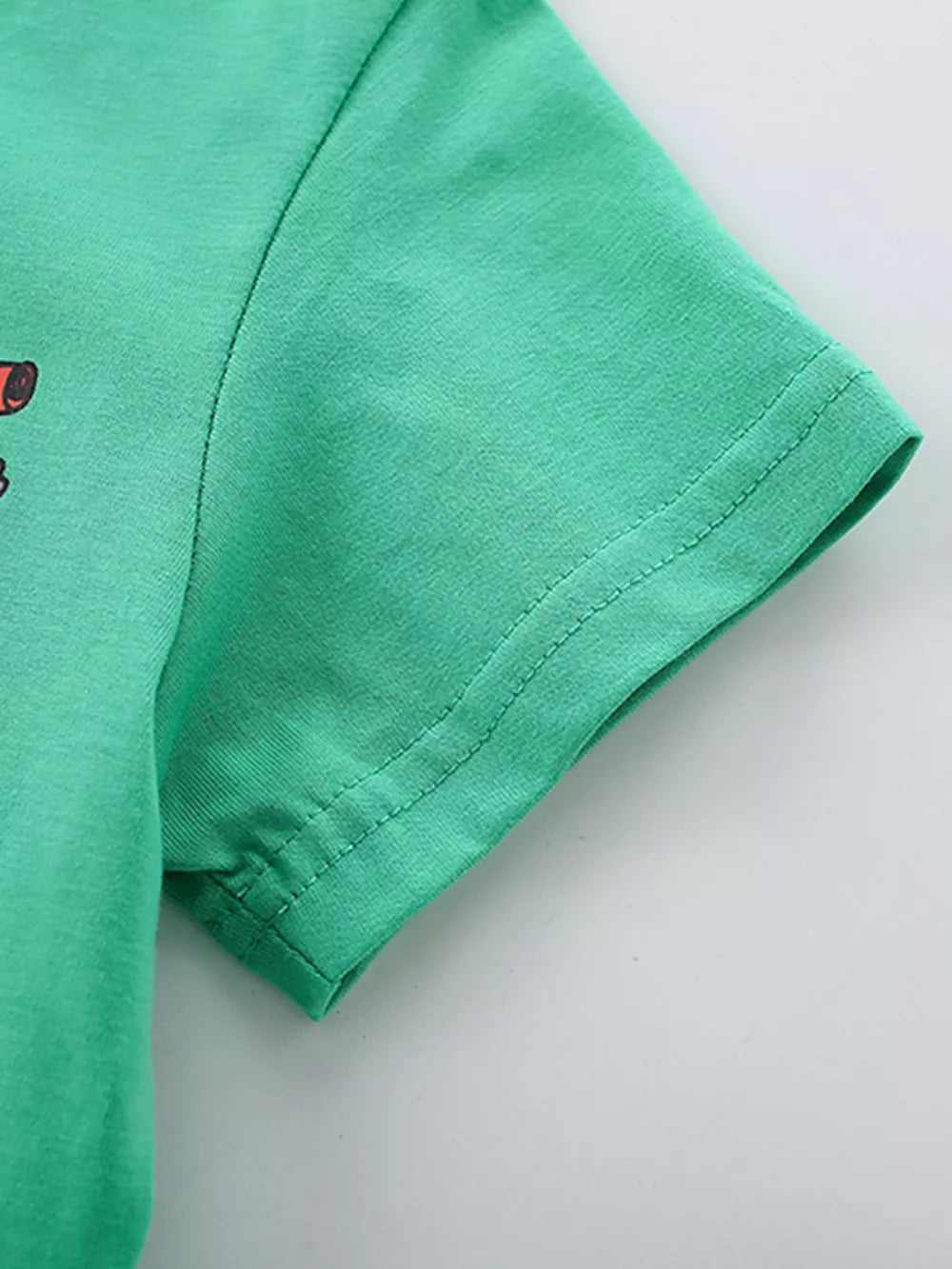 Green cotton toddler t-shirt with truck print detail