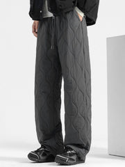 Men's dark gray quilted sweatpants with relaxed fit and drawstring waist.