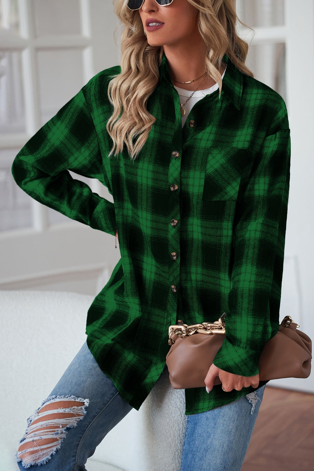 Dark green plaid drop-shoulder jacket with button front and chest pocket.