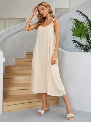 Cream ruffled strap midi slip dress in 100% rayon with A-line cut.