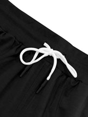 Black chino shorts with drawstring waist and elastic band detail.