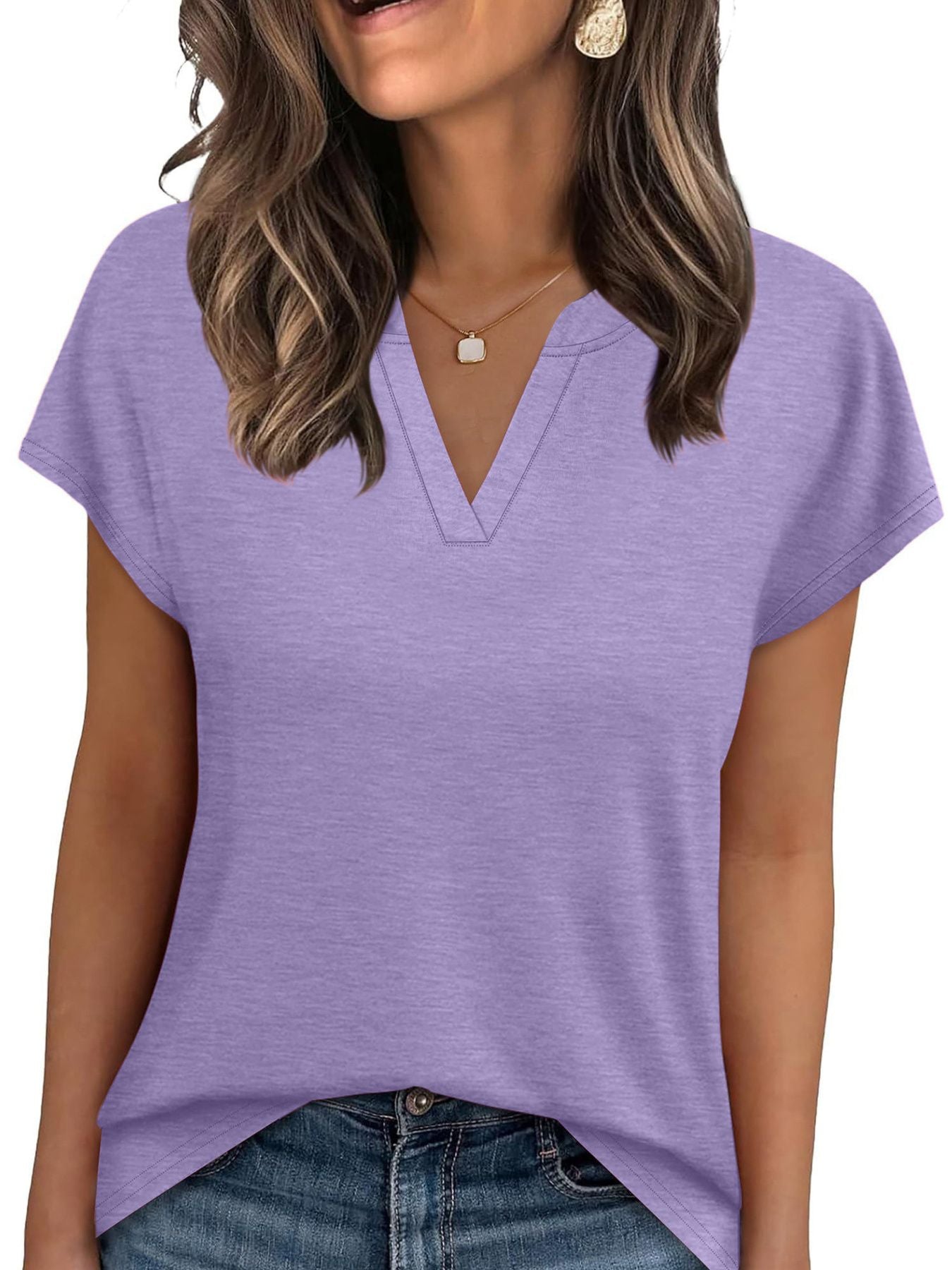 Purple heathered t-shirt with short sleeves and a notched V-neck, styled with jeans.