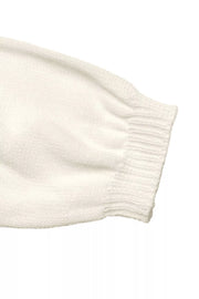 Beige acrylic knit cardigan sleeve with ribbed cuff detail