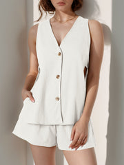 White linen co-ord set with button-front sleeveless top and shorts.