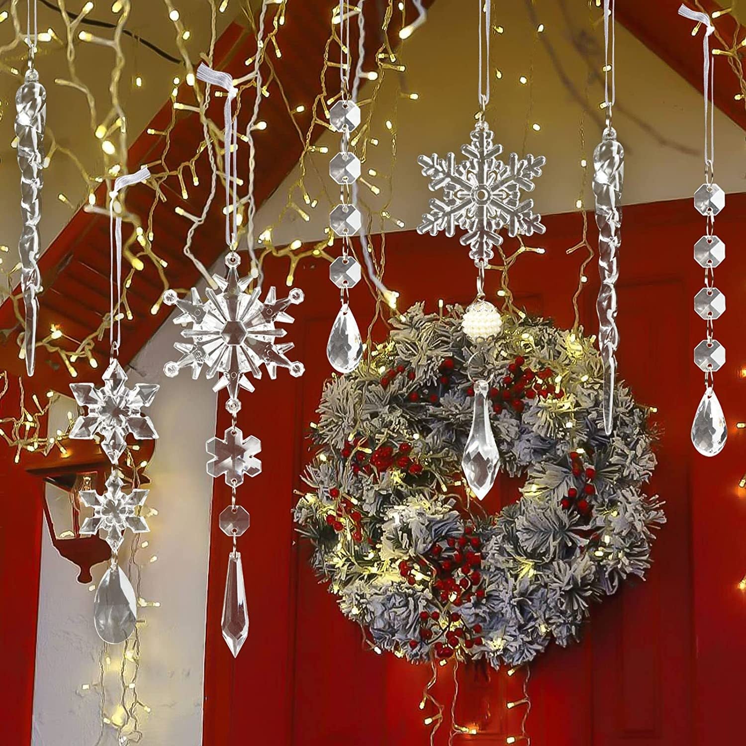 Transparent acrylic snowflake and icicle Christmas ornaments hang near a festive wreath.