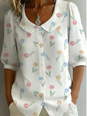 Peter Pan collar blouse with floral print and button-down front.