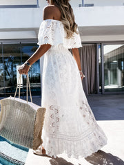 White eyelet lace off-shoulder maxi dress with ruffled sleeves and tiered skirt.