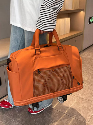 Orange rolling travel organizer bag with plaid pocket and bungee cords