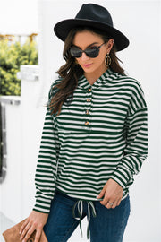 Forest green and white striped relaxed fit hoodie with button neck detail.