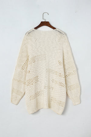 Beige open-knit slouch cardigan with airy diamond pattern and long sleeves.