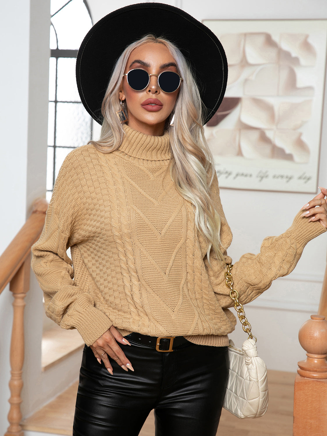 Khaki cable knit turtleneck sweater with textured details and a relaxed fit.