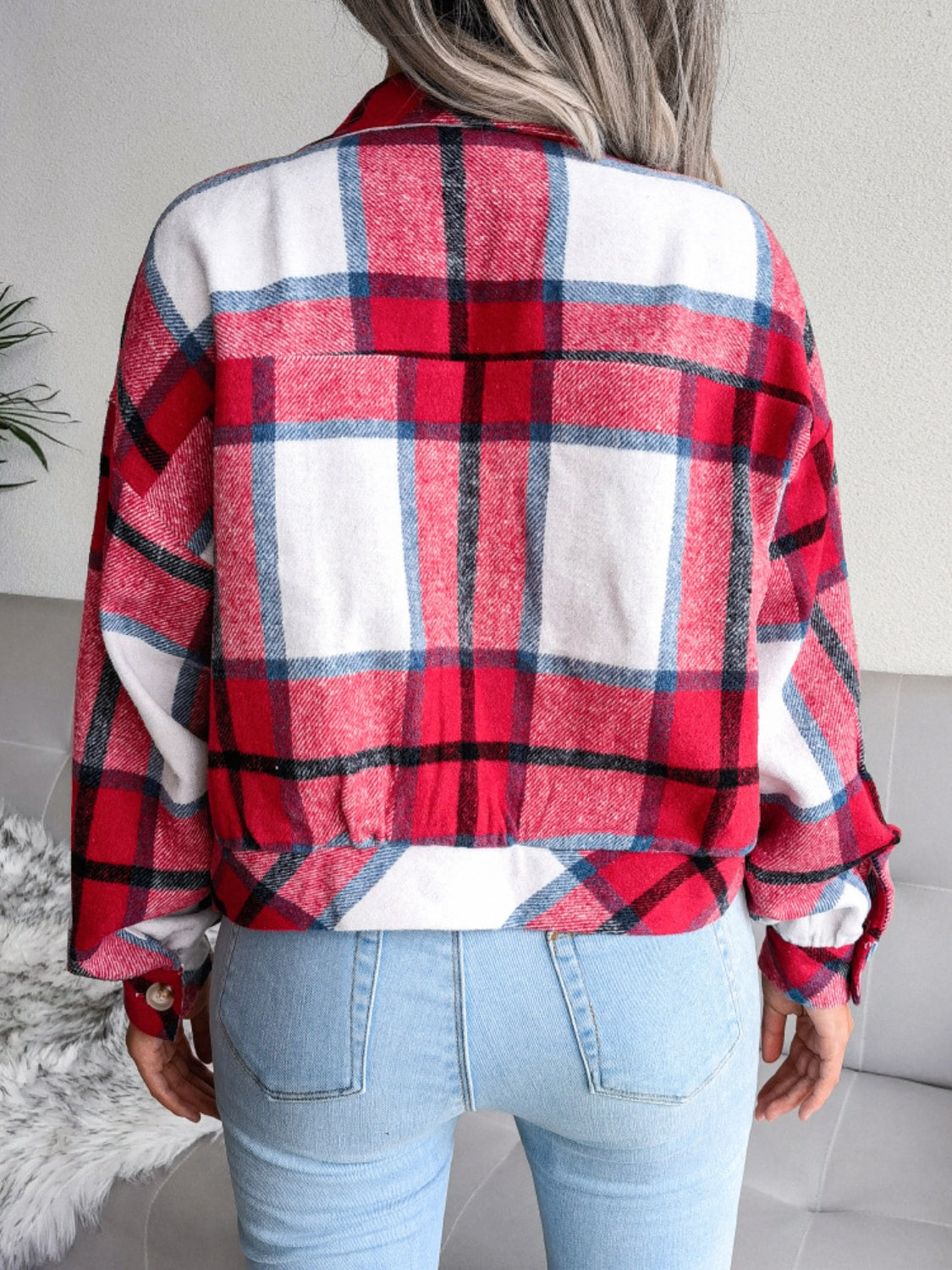 Oversized red, white, and blue plaid shacket with buttoned cuffs and elastic hem.