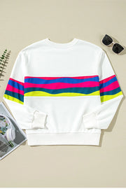 White crewneck sweatshirt with colorful horizontal stripes on chest and sleeves, ribbed cuffs and hem.
