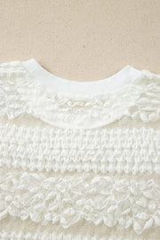White sheer t-shirt with lace patchwork and textured fabric details.