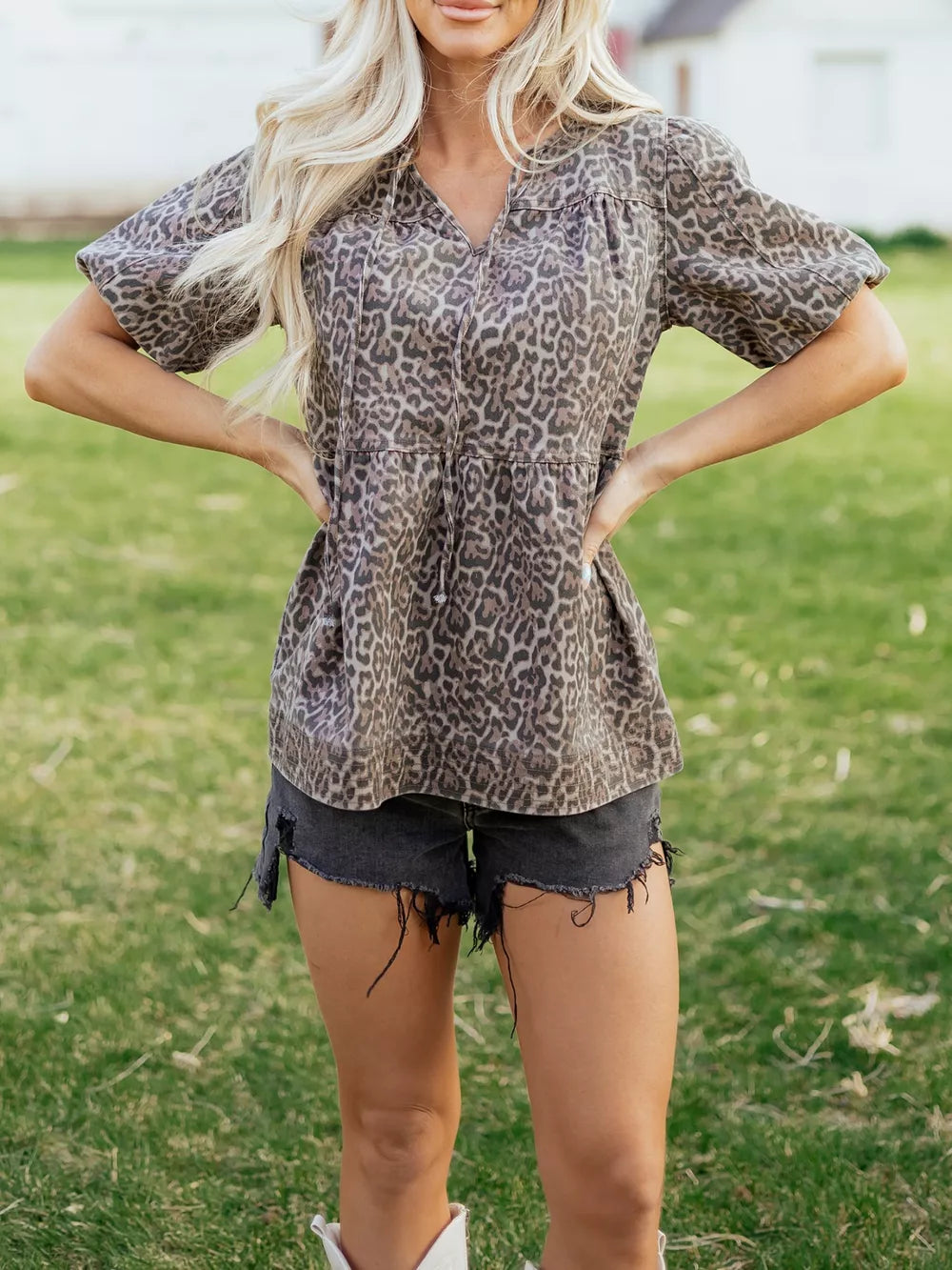 Leopard print V-neck denim top with drawstring and short sleeves.