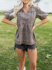 Leopard print V-neck denim top with drawstring and short sleeves.