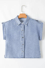 Light blue denim shirt jacket with rolled sleeves and button front, detailed with epaulets.
