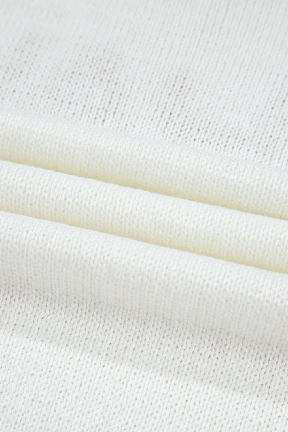 White knit sweater with stitch trim detail