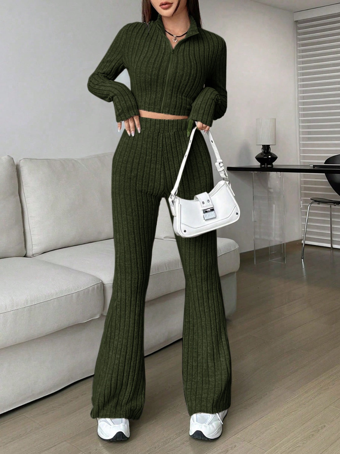 Ribbed knit flare co-ord set in army green with zip-neck crop top and high-waisted flared pants.