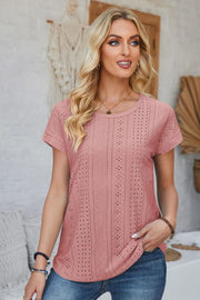 Perforated eyelet tee in blush pink with cuffed short sleeves and a crew neck.