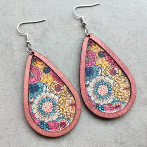 Teardrop woodgrain earrings with a colorful floral print in dusty pink.