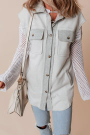 Light gray utility vest with contrast trim and button-down front, paired with a white mesh sleeve top.