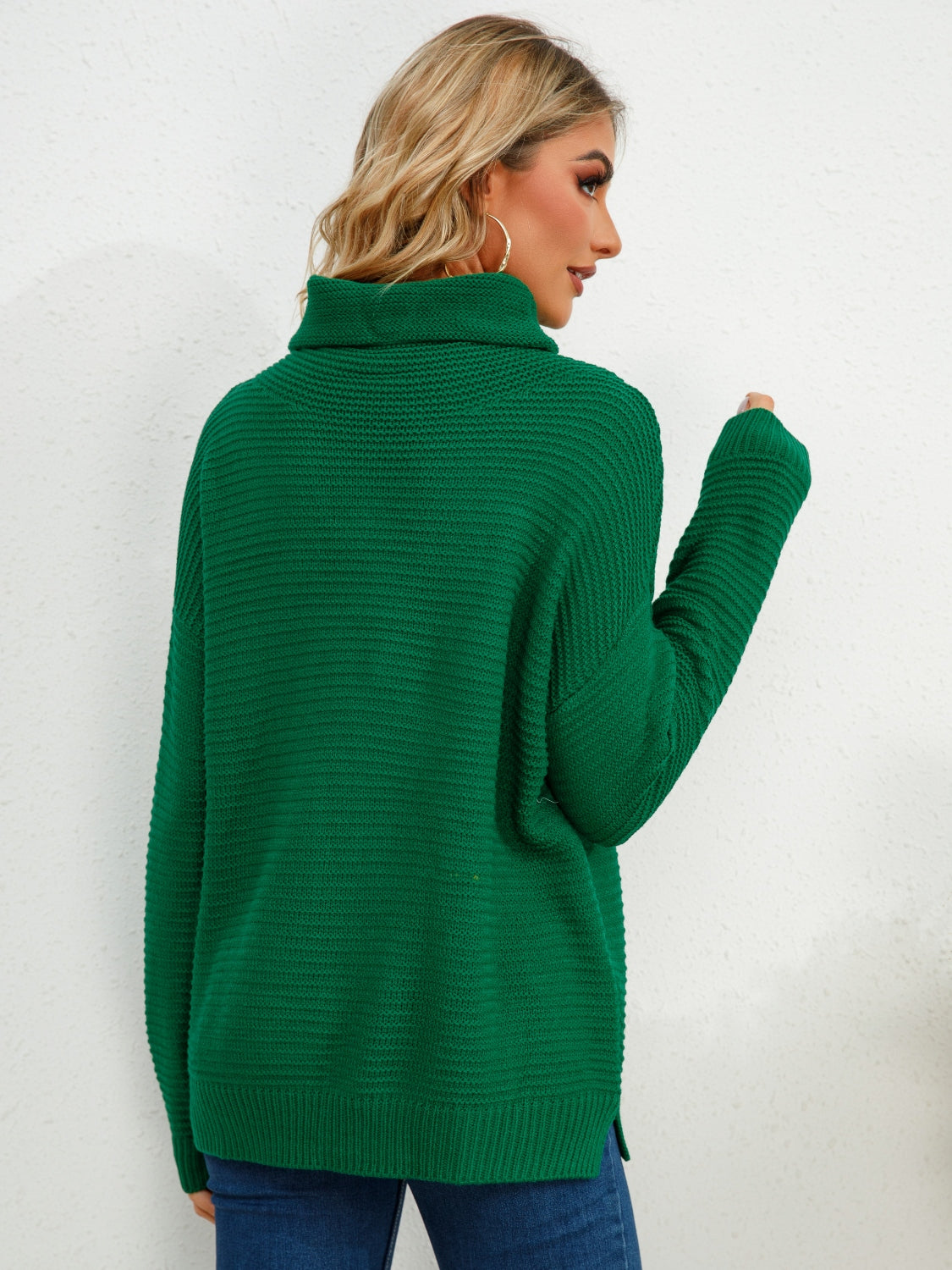 Textured knit oversized turtleneck pullover in Dark Green with ribbed details.