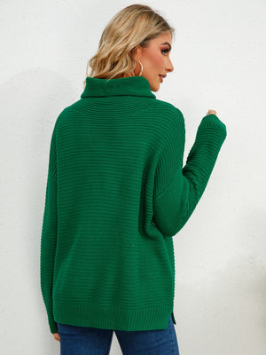 Textured knit oversized turtleneck pullover in Dark Green with ribbed details.