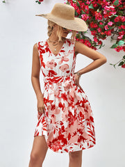 Watercolor floral tiered mini dress with V-neck and belted waist.