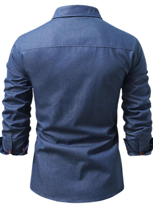 Denim blue casual button-down shirt with pocket details and red button cuffs.
