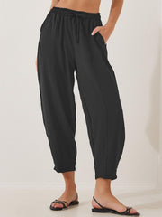 Black balloon trousers with drawstring waist and sculpted seamline detail