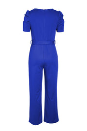Royal blue jumpsuit with puffed sleeves, belted waist, and wide legs.