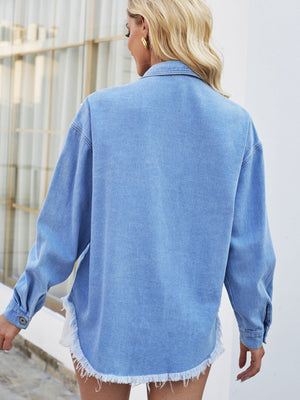 Blue denim shirt jacket with pearl embellishments and frayed hem.