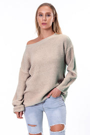Off-shoulder waffle knit sweater in beige with slouchy fit and boat neck.