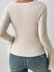 Dust Storm ribbed flare sleeve top with contrast trim neckline.