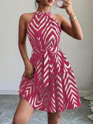 Rose red halter neck tie-waist ruffle dress with a chevron pattern.