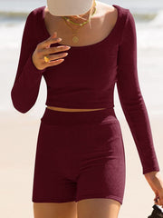 Burgundy ribbed knit crop top and shorts set with scoop neck and long sleeves.