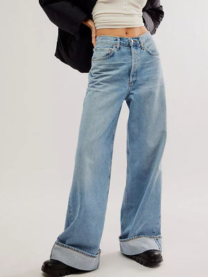 Light blue cuffed wide-leg denim trousers with a relaxed fit.
