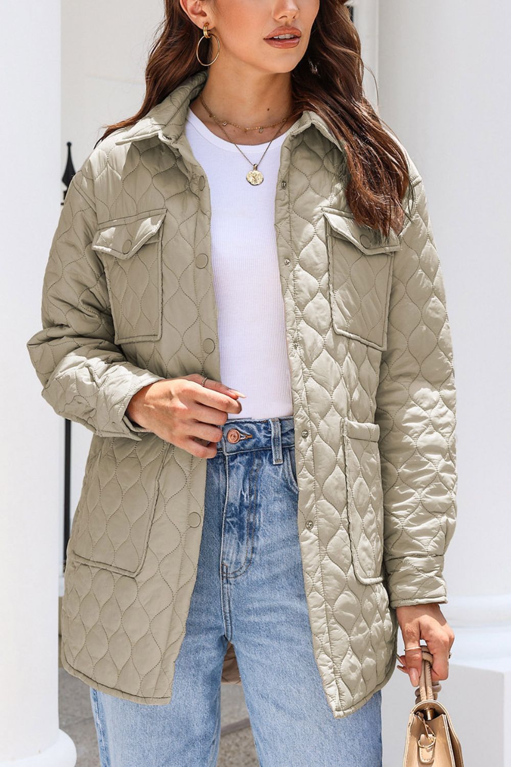 Quilted utility jacket in Khaki with button-front, collar, and chest pockets.