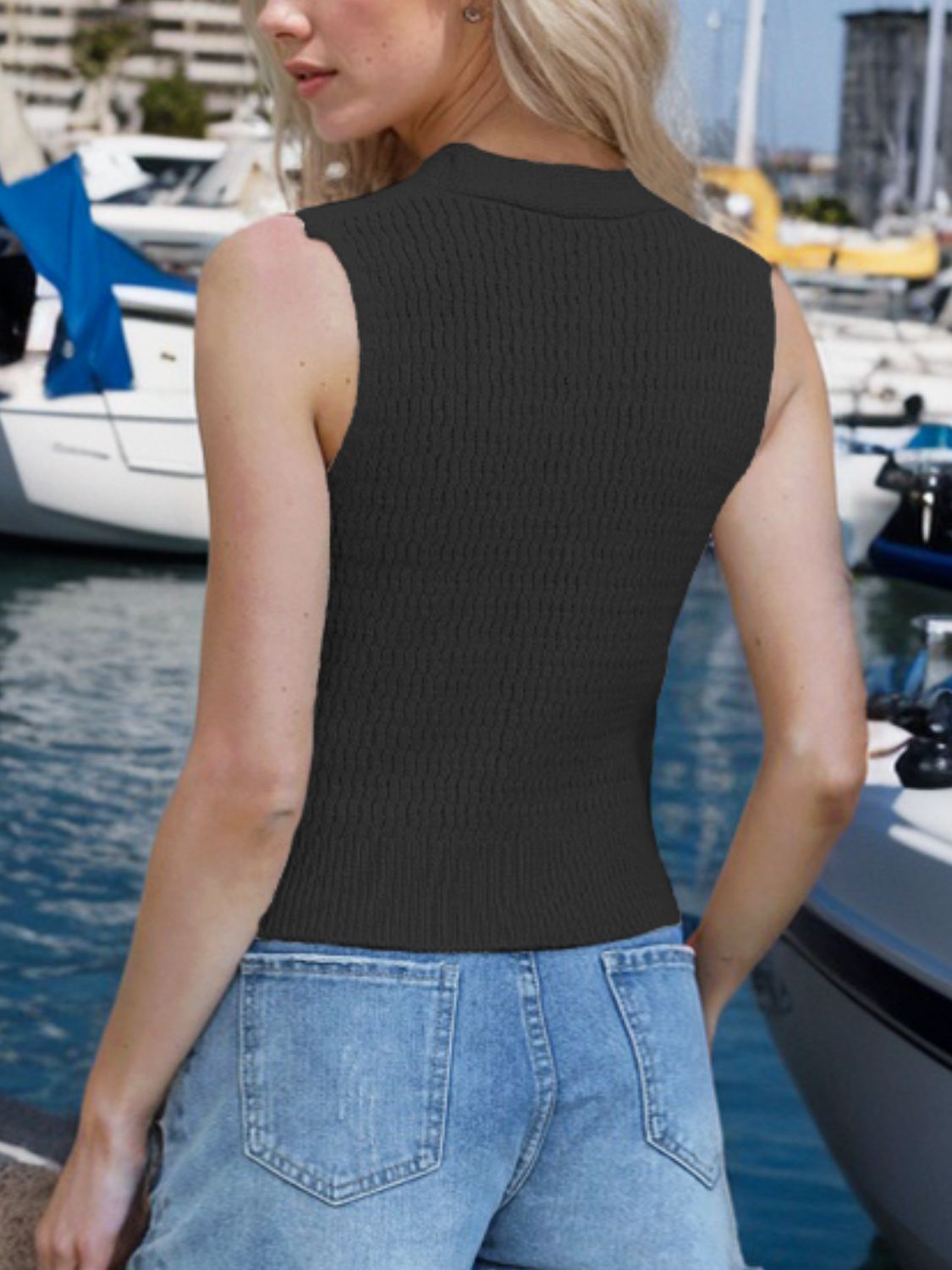 Black ribbed knit tank top with button front and mock neck.