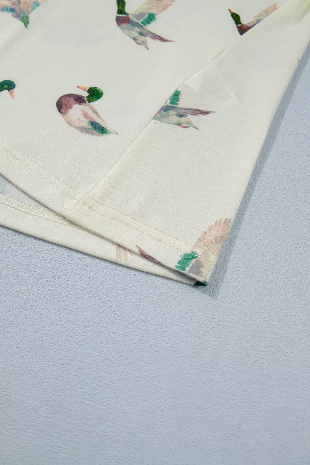Cream tank top with allover mallard duck print and casual basic style
