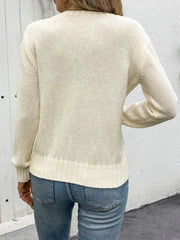 Cream crewneck knit sweater with lace inset detail and ribbed cuffs and hem.