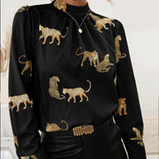 Black leopard print blouse with keyhole neck and long sleeves.