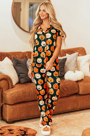 Pumpkin Patch Pajama Set with short sleeves and pants, featuring a dark green base with an all-over pumpkin print.