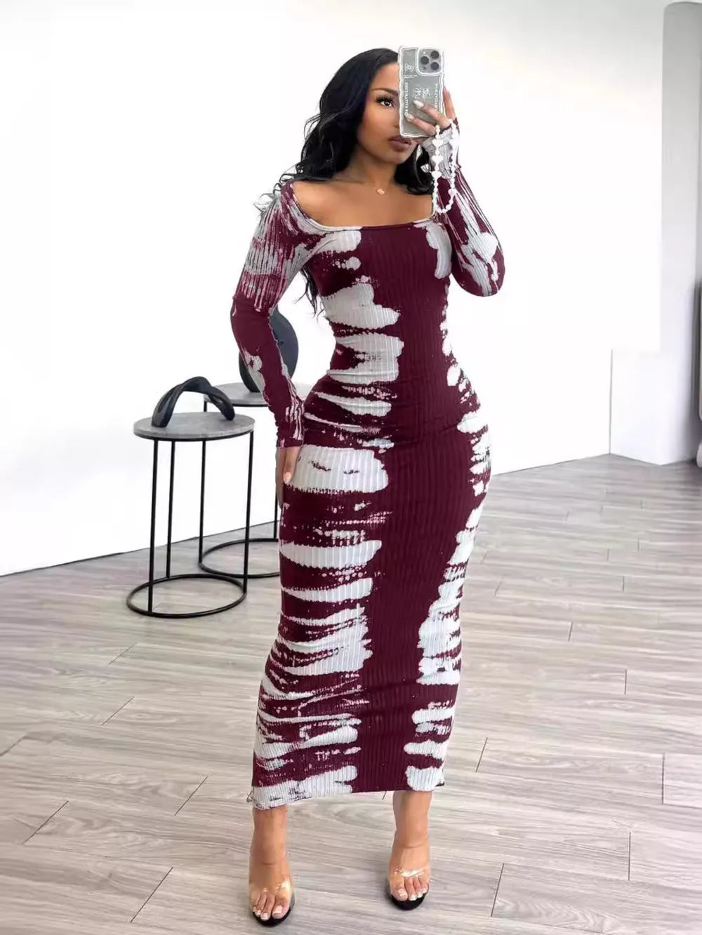 Wine red tie-dye maxi dress with long sleeves and a square neckline.