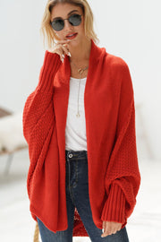 Orange-red acrylic cocoon knit sleeve cardigan with a relaxed fit and textured sleeves.