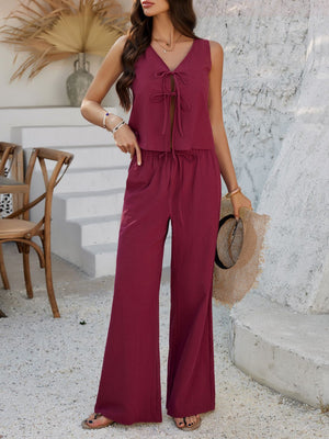 Burgundy linen tie-front palazzo pant set with sleeveless V-neck top and wide-leg pants.