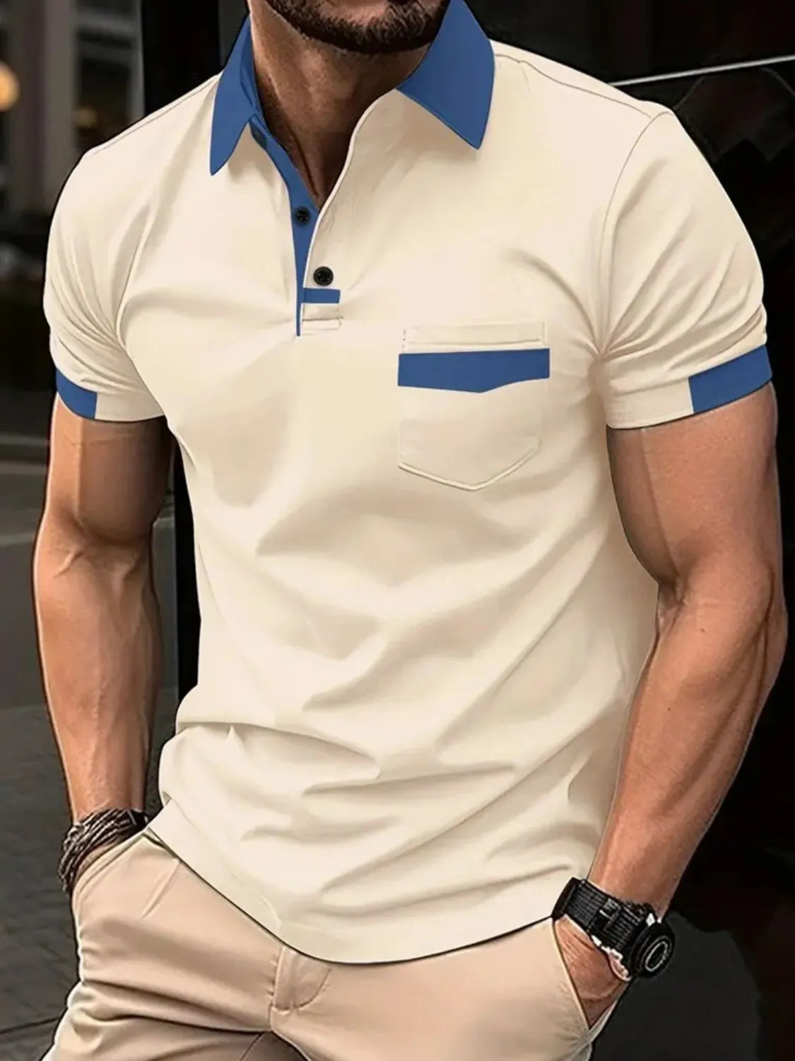 Beige polo shirt with blue collar, pocket detail, and sleeve trim.