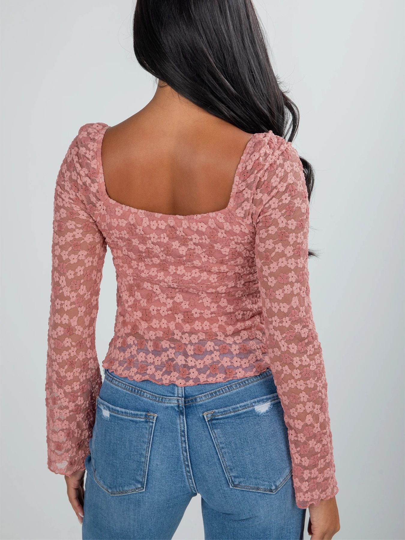 Pink floral lace blouse with square neckline and ruched sides.