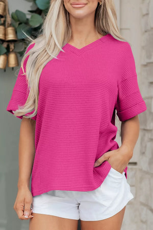Hot Pink waffle knit V-neck t-shirt with short sleeves and a relaxed fit.